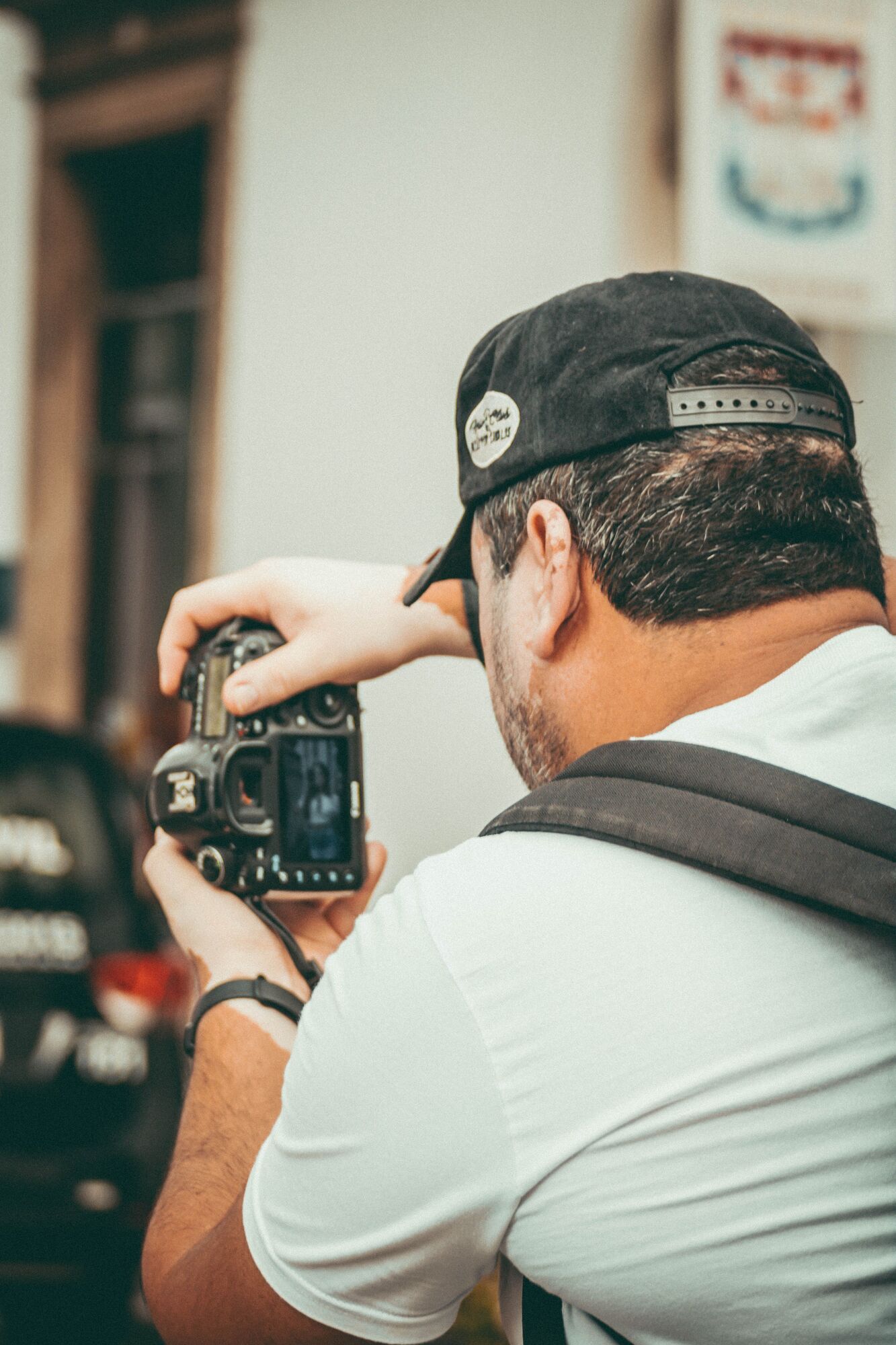 A photographer checks a shot on their camera.