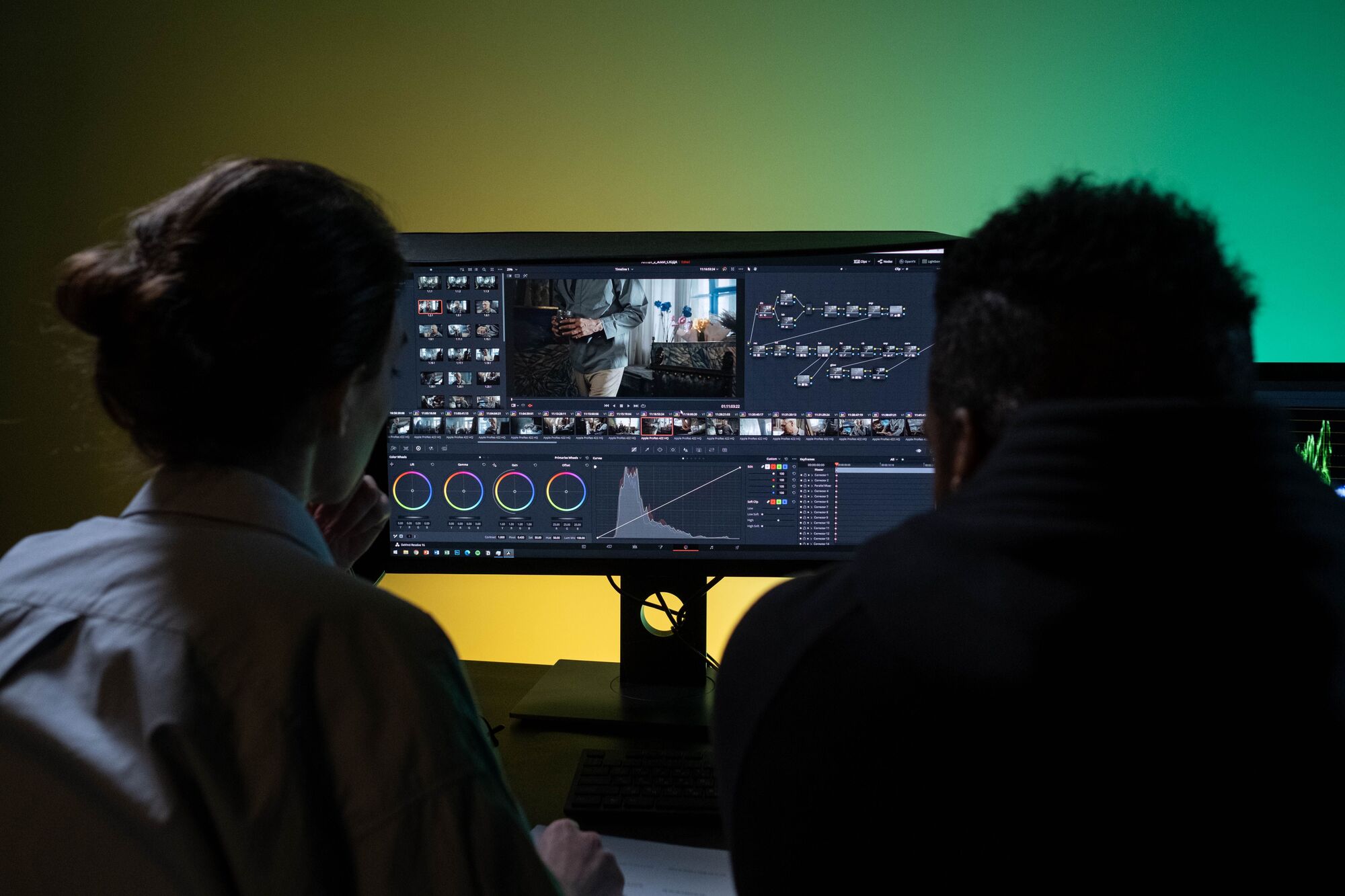 Two colorists review and discuss a shot together.